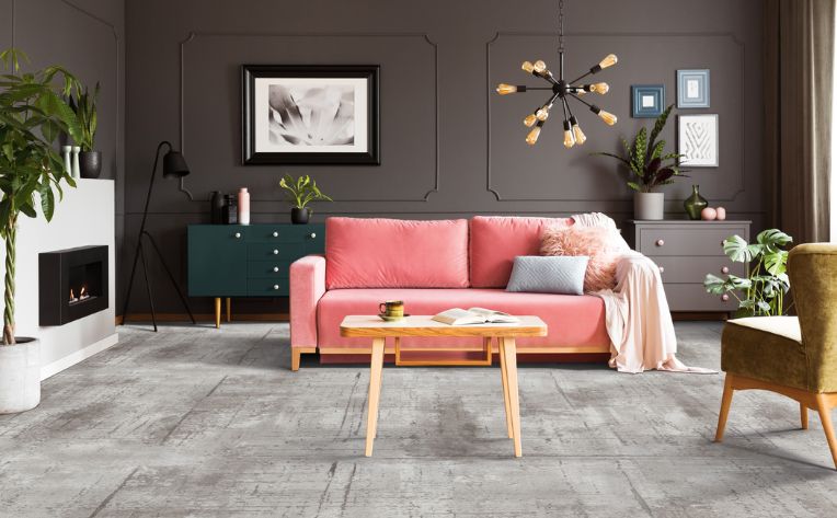 grey patterned carpet in living room with velvet pink couch